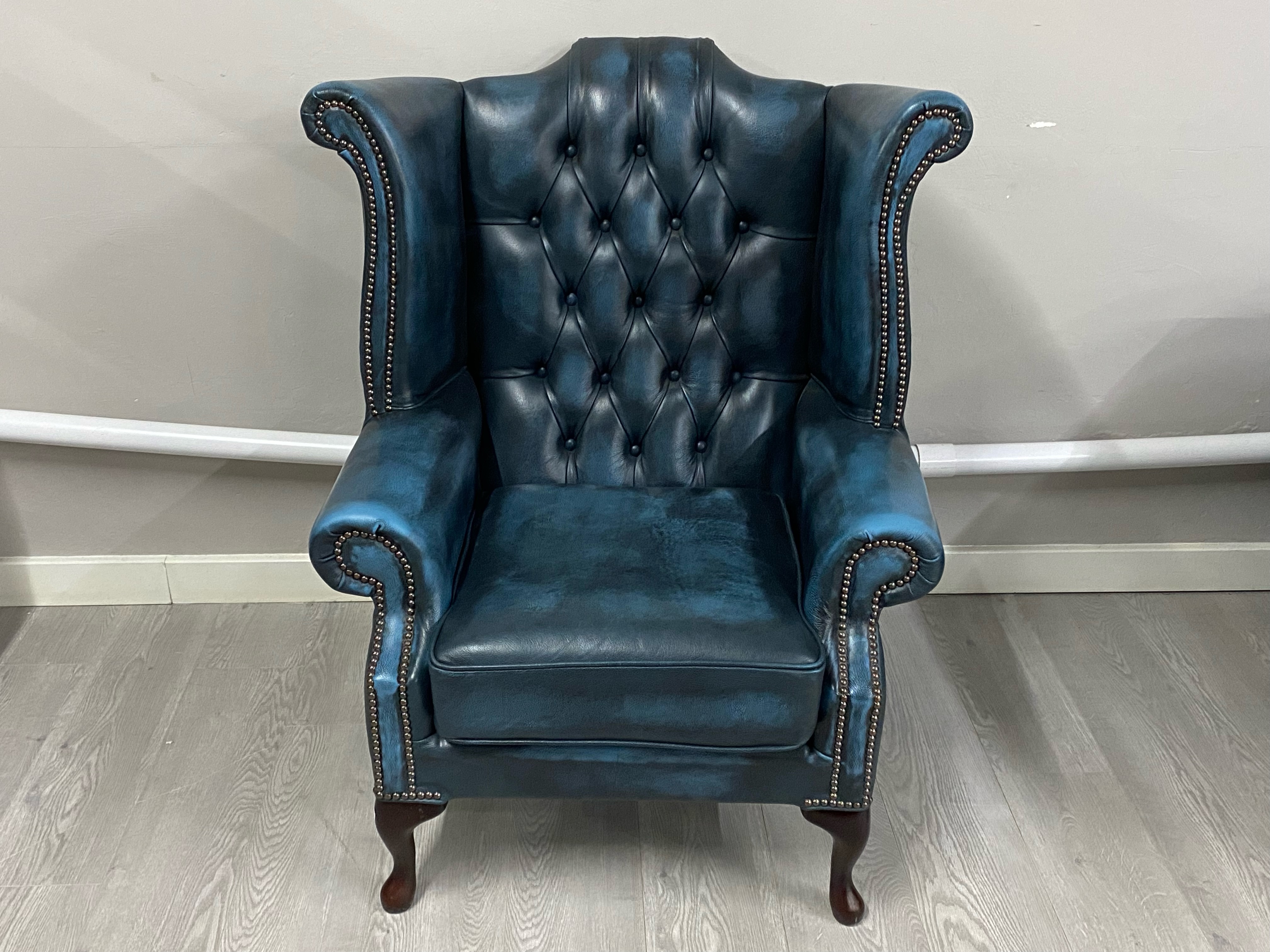 A large four seater blue leather chesterfield upholstered in blue leather, and a matching wingback - Image 3 of 5