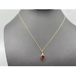 9ct Gold Diamond and garnet pendant and 9ct Gold necklet, 1.1g
