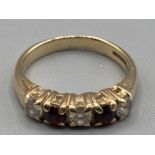 Ladies 9ct yellow gold garnet and CZ band size J 2.9g gross