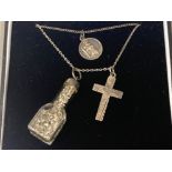 2 silver necklaces with a St-Christopher pendant & Cross, plus a glass bottle containing flakes of
