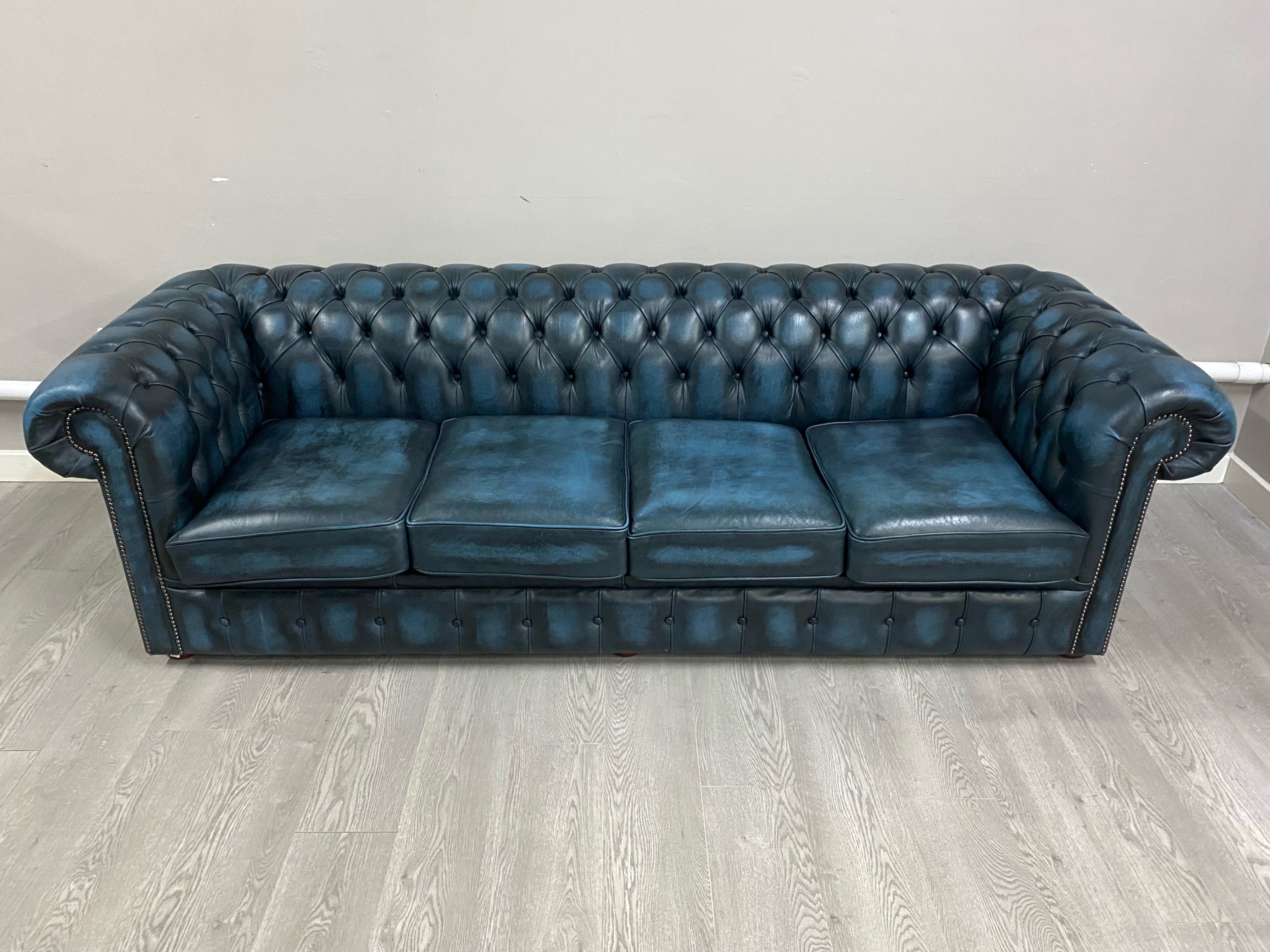 A large four seater blue leather chesterfield upholstered in blue leather, and a matching wingback - Image 2 of 5