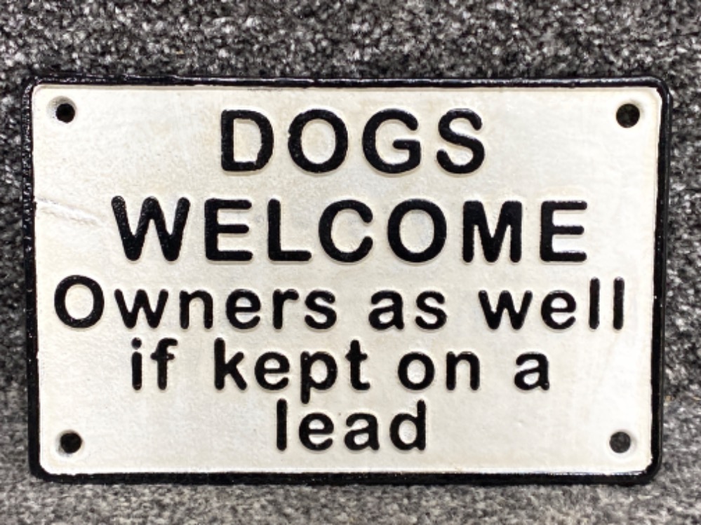 Cast metal novelty sign “Dogs welcome, owners as well if kept on a lead”