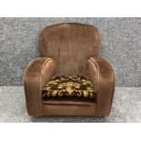 Childs brown armchair with floral pattern cushion