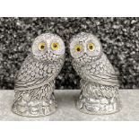 A pair of owl condiments with glass eyes stamped 800, 100.2g