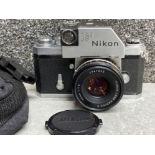 Nikon F photomic film camera with lens