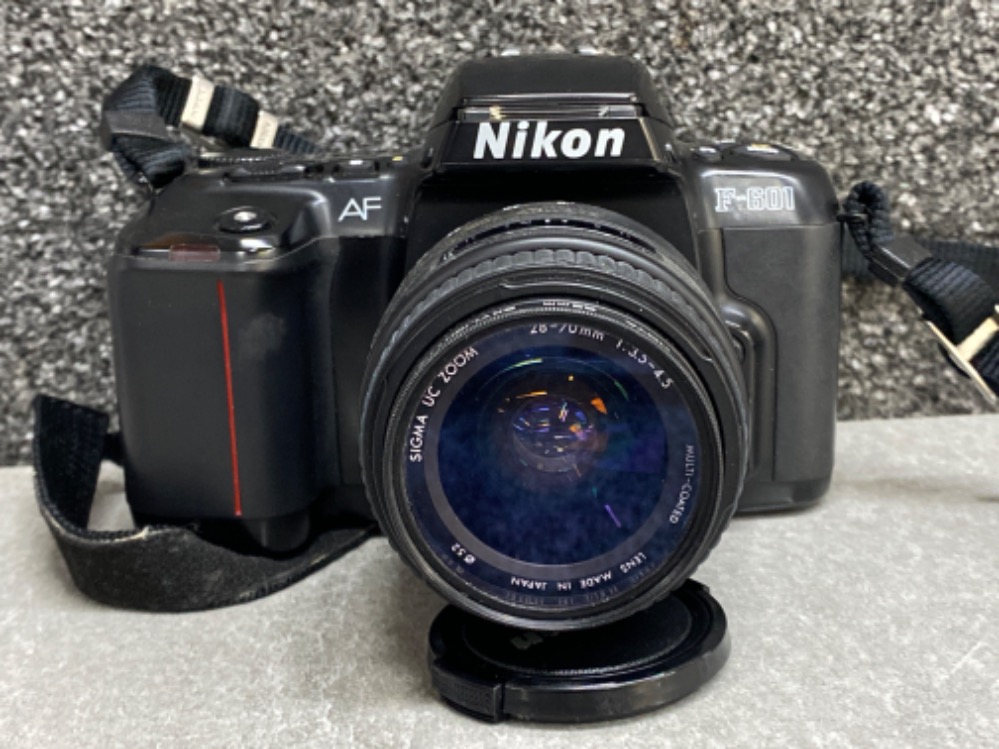 Nikon F-601 camera with Hoya 52mm skylight lens