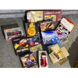 Box containing miscellaneous items including diecast cars, PC games, desk lamp etc