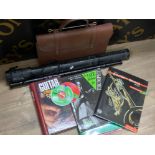 Ebony Irish flute & leather bag of music books & CDs