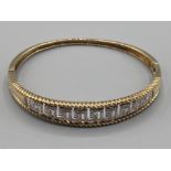 Ladies 9ct yellow gold and diamond bangle approx .25ct 14.3g gross