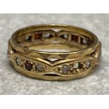 9ct gold garnet & synthetic spinel eternity ring, (1x garnet missing) size M1/2, 3.6g gross