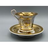 Meissen gold patterned cup and saucer.