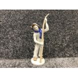 Lomonsov the boy skier by stolbova figurine of a boy waxing his ski 1950s metzler and ortloff German