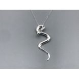 A silver snake pendant on chain 10.29g