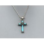 A silver and turquoise crucifix pendant with chain 4.35g gross