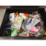 Box containing rosary beads and charity badges etc