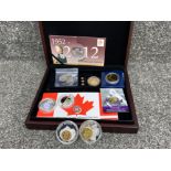 Coin case containing a variety of collectors coins including Great Britain, Canadian & 24k gold