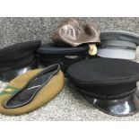 5x military hats, plus one other