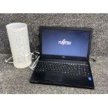 Fujitsu lifebook A555 lap top with charger, includes a contemporary desk lamp