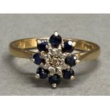 9ct yellow gold sapphire & diamond cluster ring, ring comprises of 1x centre diamond surrounded by