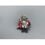 A silver enamel puss and boots brooch 9.20g gross