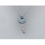 A silver cz and blue topaz snake style pendant with chain 6.38g gross