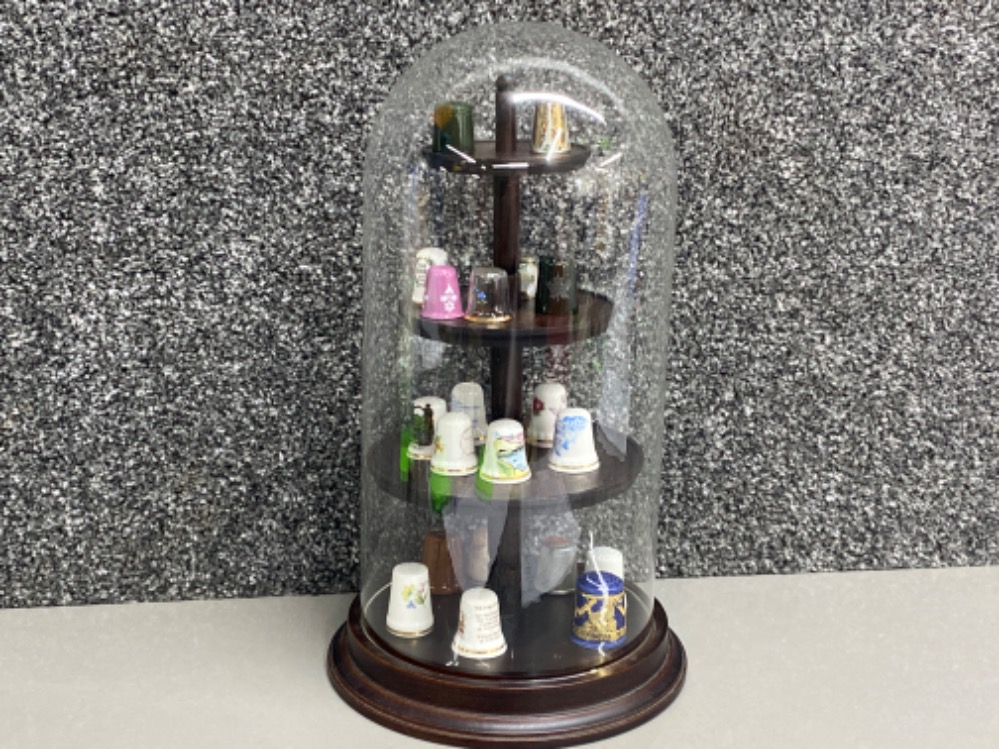 Mixture of thimbles in a glass dome display case, 17 in total