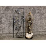 A floor standing caged candle light holder & metal framed wall art with flower design