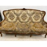 Carved Mahogany framed 19th century 3 seater sofa, with upholstered & metal studded floral patterned