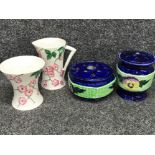 Four piece mailing lustre ware to include two flower vases, jug and vase