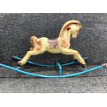 Vintage plastic and metal rocking horse