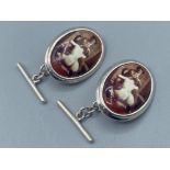 A pair of silver and enamel cufflinks with nude pictorial image, 9g gross