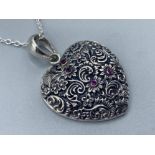 Silver heart shaped pendant necklace set with cabochon rubies, 8.4g gross