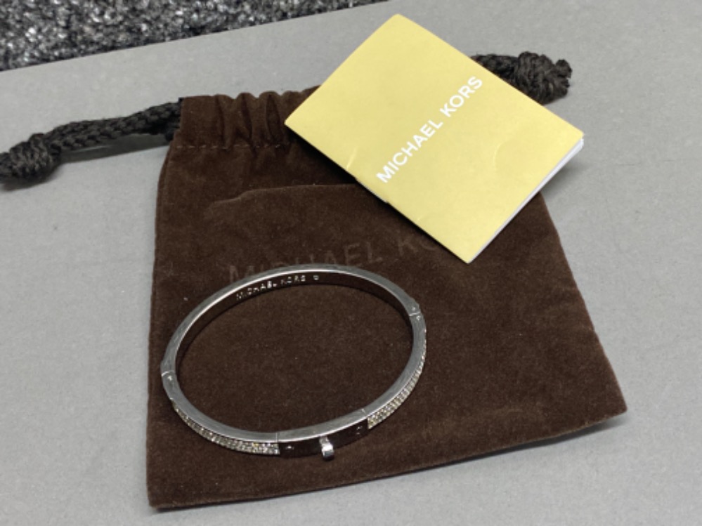 Michael Kors bangle with booklet & pouch