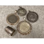 4x coin pendants of which 3 are mounted in silver holders, also includes a silver thimble