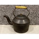 Antique cast iron kettle with brass handle