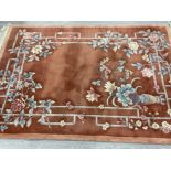 Fringed Chinese floral patterned rug, 245x167cm