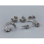 Brand new ex-display sterling silver and white stone belly ring and two pairs of silver earrings,