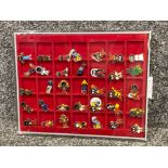Total of 35 1950s Golly Wog badges, in sliding top display case