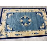 Floral patterned contemporary rug - primary colours blue & cream 97x61cm