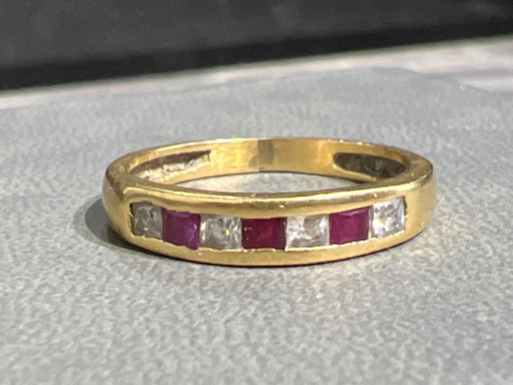 Ladies 18ct gold Ruby and diamond band ring. 2g size L1/2