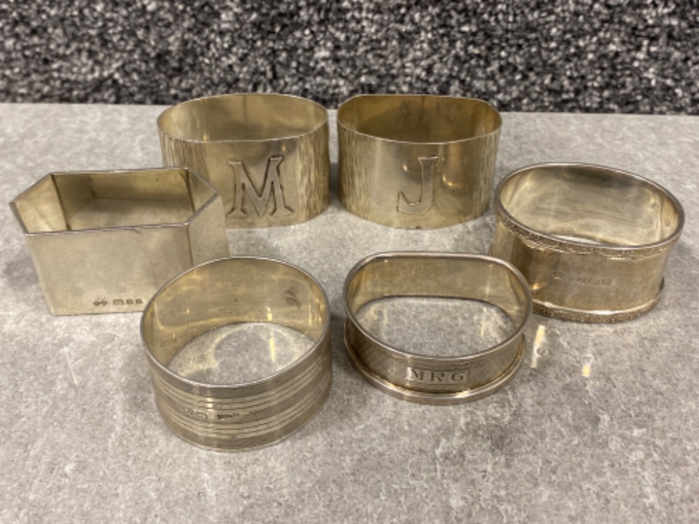 4x hallmarked silver napkin rings includes London 1978, Chester 1926 & 2x Birmingham 1955, also