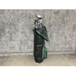 A golf bag containing Dunlop golf clubs