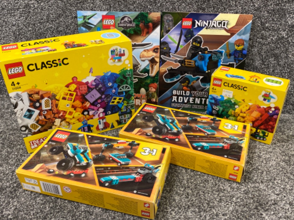 Total of 4 Boxed Lego sets & 2x Lego themed books