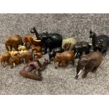 Box lot of miscellaneous hand carved elephant ornaments mainly wooden