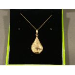 9ct gold rain drop shaped locket on 40cm long chain, 1.9g, boxed