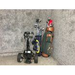 2 golf bags containing a variety of different clubs together with an electronic trolley NO BATTERY