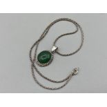 A silver and jade pendant necklace