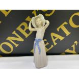 Lladro girl figure 5011 Trying on straw hat