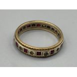 9ct yellow gold full eternity ring with ruby and white stone, size T 4g