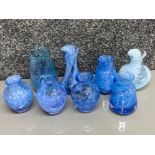 Total of 8 Caithness blue glass vases